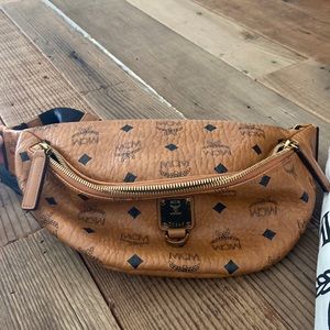 Stunning MCM fanny pack. Two zipper compartments, comes with dust bag.